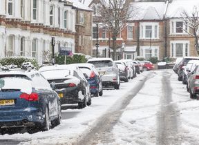 cars-parked-along-a-snow-covered-street
