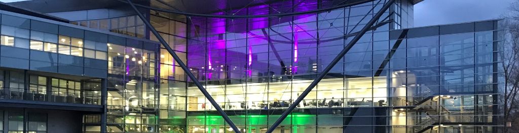 The Met Office's Exeter office illuminated at night