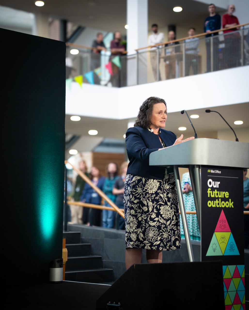 Prof Penny Endersby speaking at a lectern at the strategy launch in Met Office HQ.