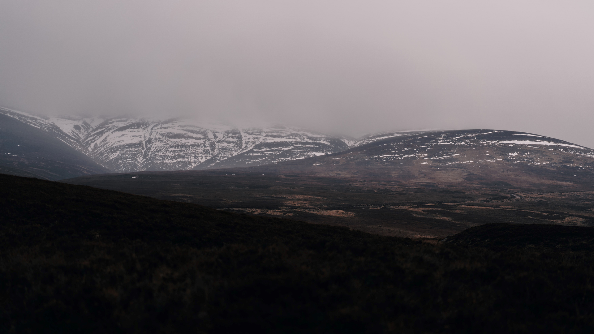 Snow over the tops of mountains in Scotland