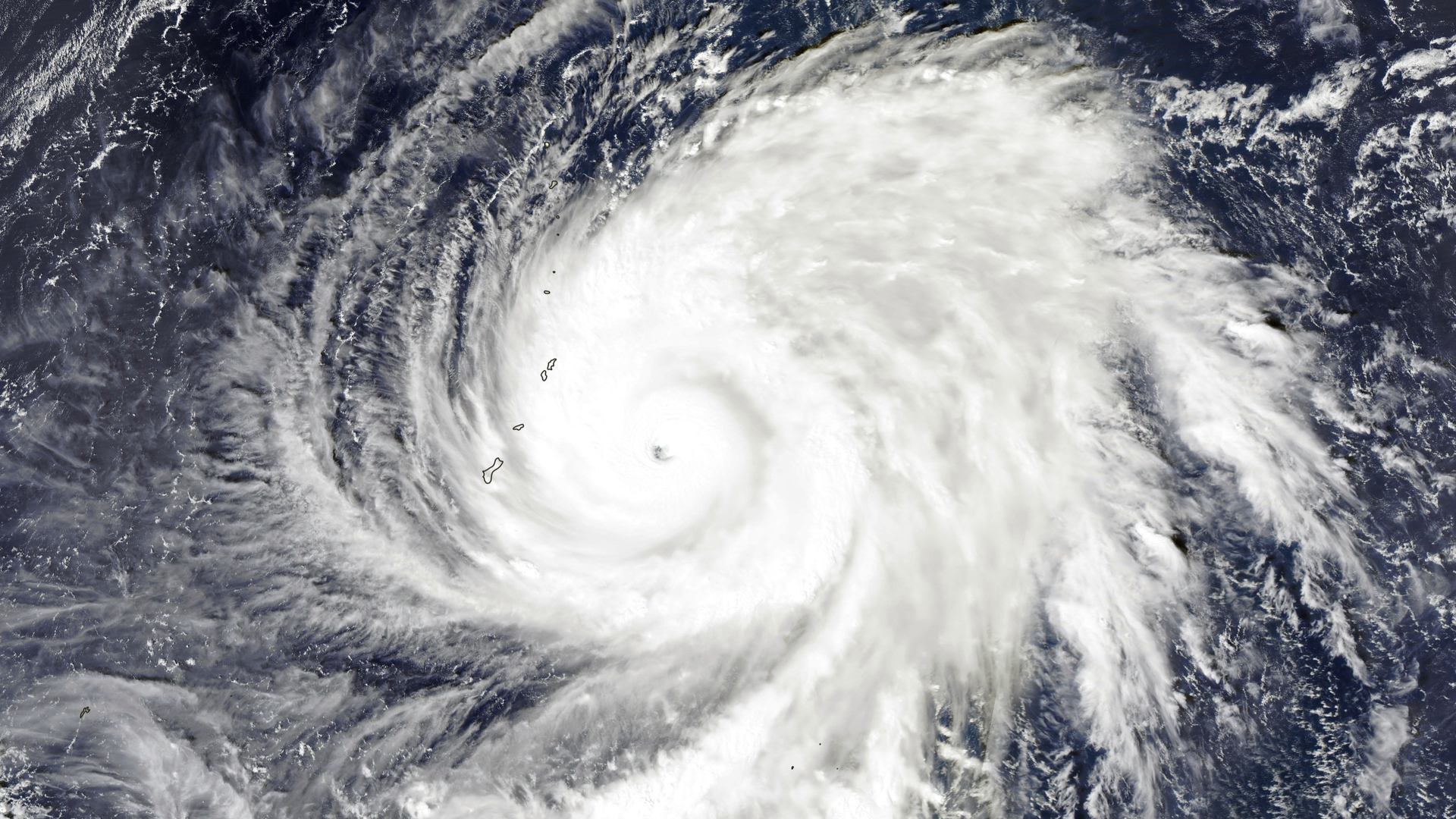 An aerial view of Typhoon Yutu showing the eye of the cyclone and swirling clouds