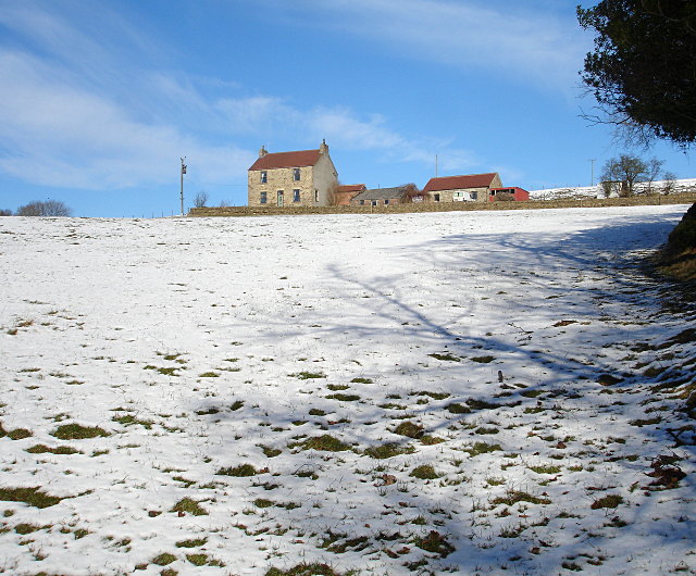 Snow on a field and farmstead in Copley