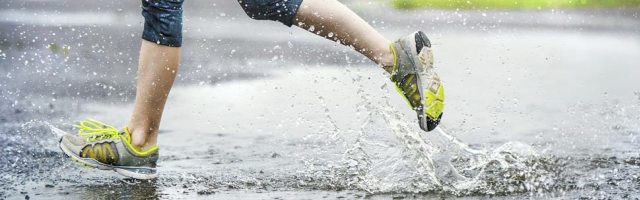 Close up of someone running in the rain