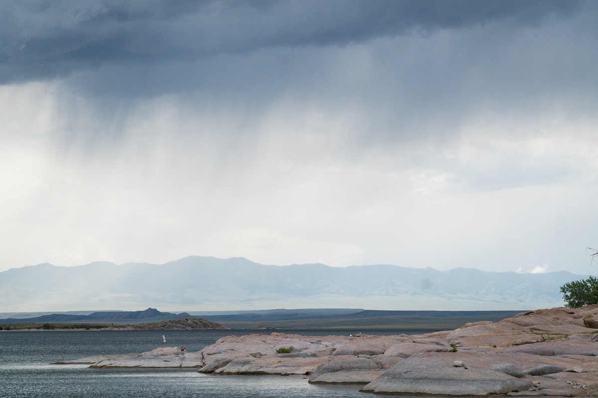 Virga falling from a cloud. Virga is precipitation that falls from a cloud but evaporates before reaching the ground, appearing as wispy tails at the base of the cloud.